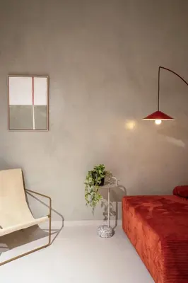 a bedroom with a bed and a chair and a lamp at MelAngelo Villas M - Modern Studio near Port of Piraeus in Piraeus