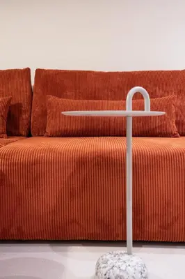 a orange couch with a table in front of it at MelAngelo Villas M - Modern Studio near Port of Piraeus in Piraeus