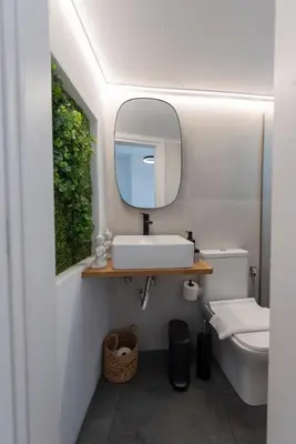 a bathroom with a sink and a mirror at 180 jacuzzi with Acropolis sunset view in Athens