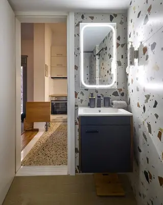 a bathroom with a sink and a mirror at Modern & Cozy Studio in Kypseli in Athens