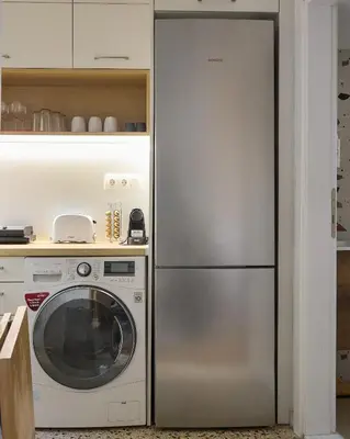 a kitchen with a refrigerator and a washing machine at Modern & Cozy Studio in Kypseli in Athens