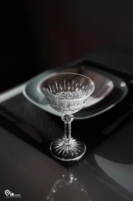 a glass wine glass sitting on a black tray with a plate at Irene's Home - Serene City Sanctuary in Athens in Athens