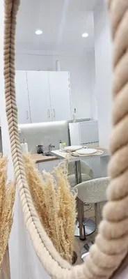 a room with tables and chairs and a rope at Best Stay Athens Metro in Athens