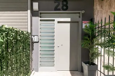 a front door of a house with a number behind it at Cassiopeia - Charming Studio & Balcony in Athens in Athens