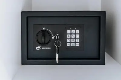 a small black clock with a key in it at Sapfo in Athens