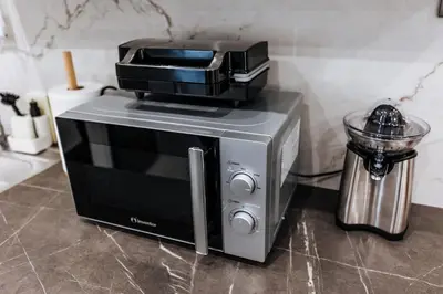 a toaster oven sitting on top of a kitchen counter at Sapfo in Athens