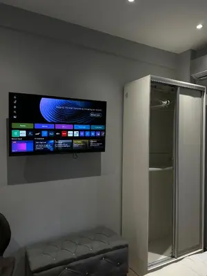 a flat screen tv on the wall of a room at Voulis Apartment 2 in Athens
