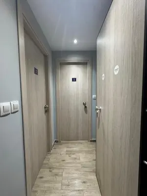 an empty hallway with two doors and a hallwayngth at Voulis Apartment 2 in Athens