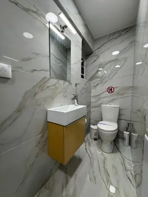 a bathroom with a sink and a toilet at Elegant Escapes 8 in Athens