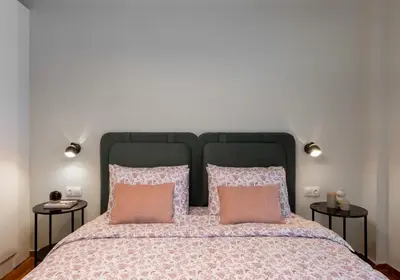 a bedroom with a large bed with two pillows at Urban Blush Pangrati by Premium Key in Athens