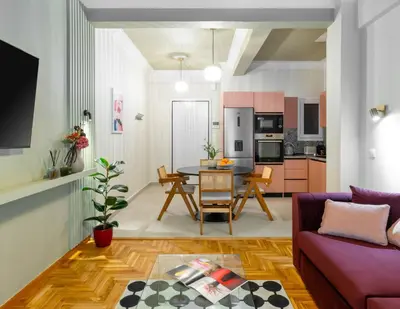 a living room with a couch and a table at Urban Blush Pangrati by Premium Key in Athens