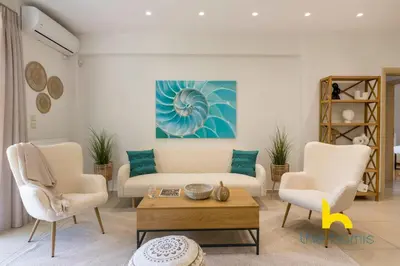 a living room with a couch and two chairs at Turquoise Seashell Retreat Family Oasis N Beach in Vari