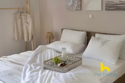 a tray of food on top of a bed at Turquoise Seashell Retreat Family Oasis N Beach in Vari