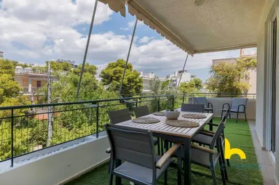 a balcony with a table and chairs and a view at Turquoise Seashell Retreat Family Oasis N Beach in Vari
