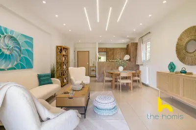 a living room with a couch and a table at Turquoise Seashell Retreat Family Oasis N Beach in Vari