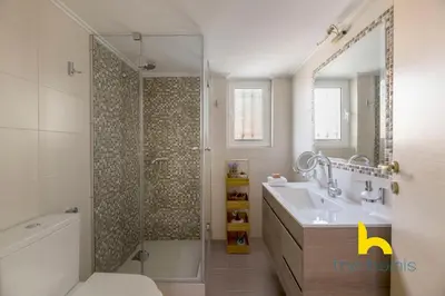 a bathroom with a shower and a sink and a toilet at Turquoise Seashell Retreat Family Oasis N Beach in Vari