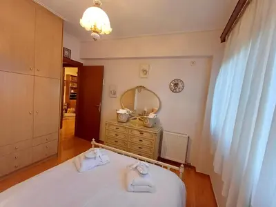 a bedroom with a bed with towels on it at Mary's vintage house in Athens