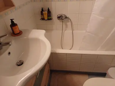 a bathroom with a sink and a bath tub at Mary's vintage house in Athens