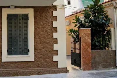 a door with a plant next to a building at 2 Bedroom Home Kallithea - Arhontoula Residences in Athens