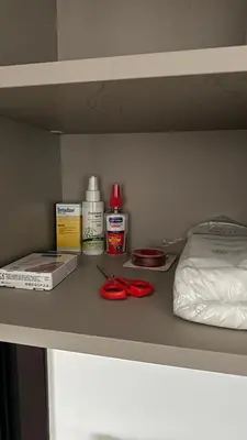 a table with some items on a shelf at A decent stay in center Glyfada in Athens