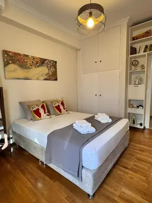 a bedroom with two beds in a room at Lycabettus Elia in Athens
