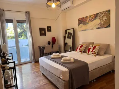 a bedroom with a large bed in a room at Lycabettus Elia in Athens