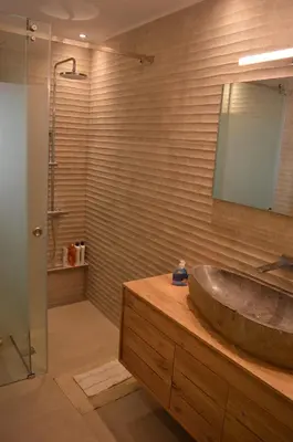 a bathroom with a sink and a shower at Amy's residence in Athens