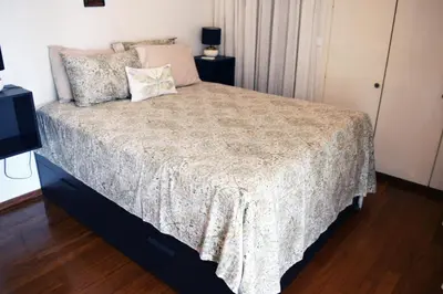 a bedroom with a bed and a television at Amy's residence in Athens