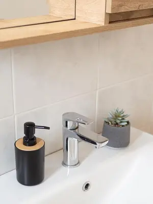 a kitchen sink with a faucet on a counter at Athens Airport Luxury Apartment in Spáta