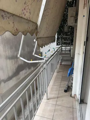 a hallway of a building with a wall with flowers on it at Sweet home in Athens