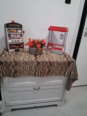 a table with flowers on top of a dresser at B2 ACROPOLIs 2 in Athens