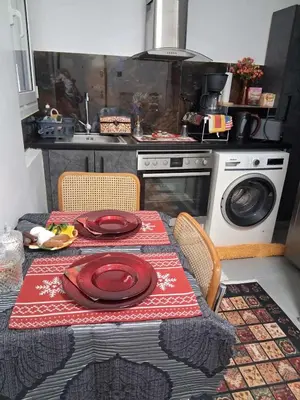 a kitchen with a table with red plates on it at B2 ACROPOLIs 2 in Athens