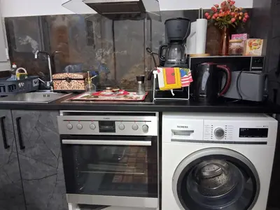 a kitchen with a stove and a washing machine at B2 ACROPOLIs 2 in Athens