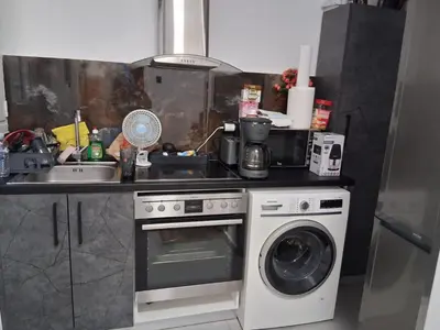 a kitchen with a sink and a washing machine at B2 ACROPOLIs 2 in Athens