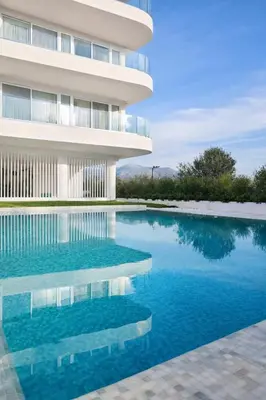 a swimming pool in front of a building at Costa Elliniko Pool & Beach Sea View DA1 in Athens