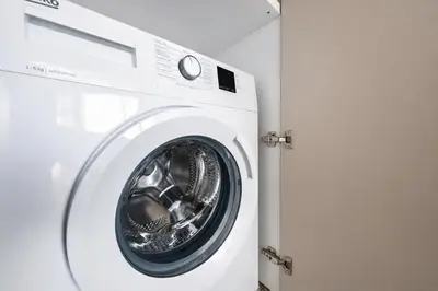 a white washing machine sitting in a room at Costa Elliniko Pool & Beach Sea View DA1 in Athens