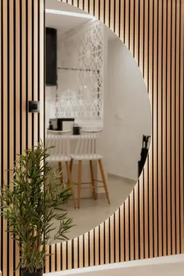 a room with a mirror and a table with a plant at 1BR Designer Suite Homey Feel Near Metro in Athens