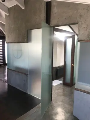 a glass door in a room with a hallway at Unique Loft with amazing view TheRampHouse Athens in Athens
