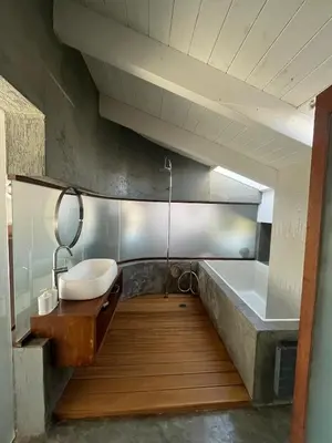 a bathroom with a sink and a bath tub at Unique Loft with amazing view TheRampHouse Athens in Athens