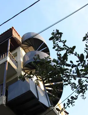 a building with a tree in front of it at Unique Loft with amazing view TheRampHouse Athens in Athens