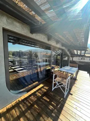 a balcony with a table and a view of the city at Unique Loft with amazing view TheRampHouse Athens in Athens