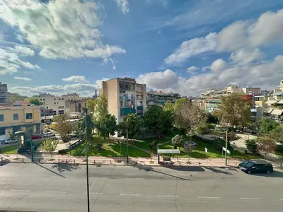 an empty parking lot in a city with buildings at Boutique City Apartment 3' Metro in Athens