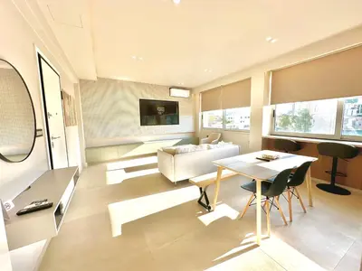 a living room with a table and a couch at Boutique City Apartment 3' Metro in Athens