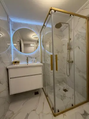 a bathroom with a shower and a sink at City Center Lux Studio in Athens
