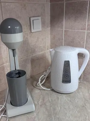 a blender and a coffee maker on a counter at Parmen APT in Piraeus