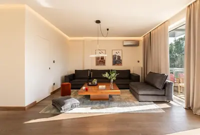 a living room with a couch and a table at Mia Homes - Athens Riviera at Voula Center in Athens