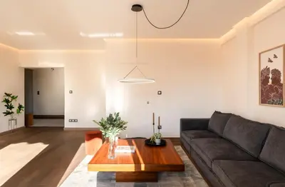 a living room with a couch and a table at Mia Homes - Athens Riviera at Voula Center in Athens