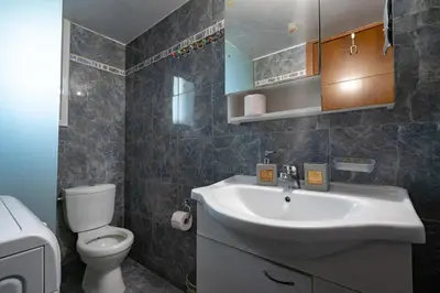 a bathroom with a sink and a toilet at City Base for 2 - Kolonos near Metro by ΜΡS in Athens