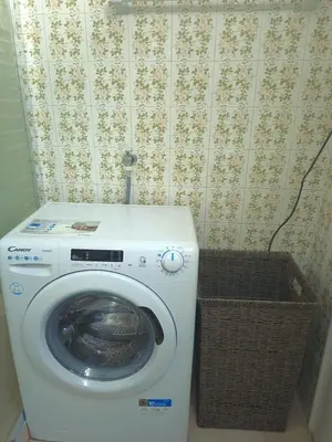 a washing machine in a bathroom with a basket at The Cozy Blue Flat in Athens