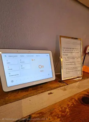 a tablet computer sitting on a table next to a sign at Cozy Smart studio apartment in Athens in Athens